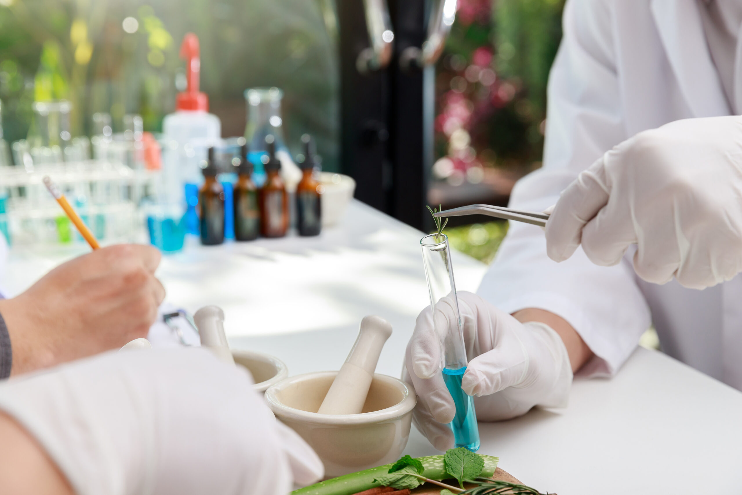The scientist or doctor make herbal medicine from herb in the laboratory on the table. Herb medicine with herbal the organic natural in the laboratory.